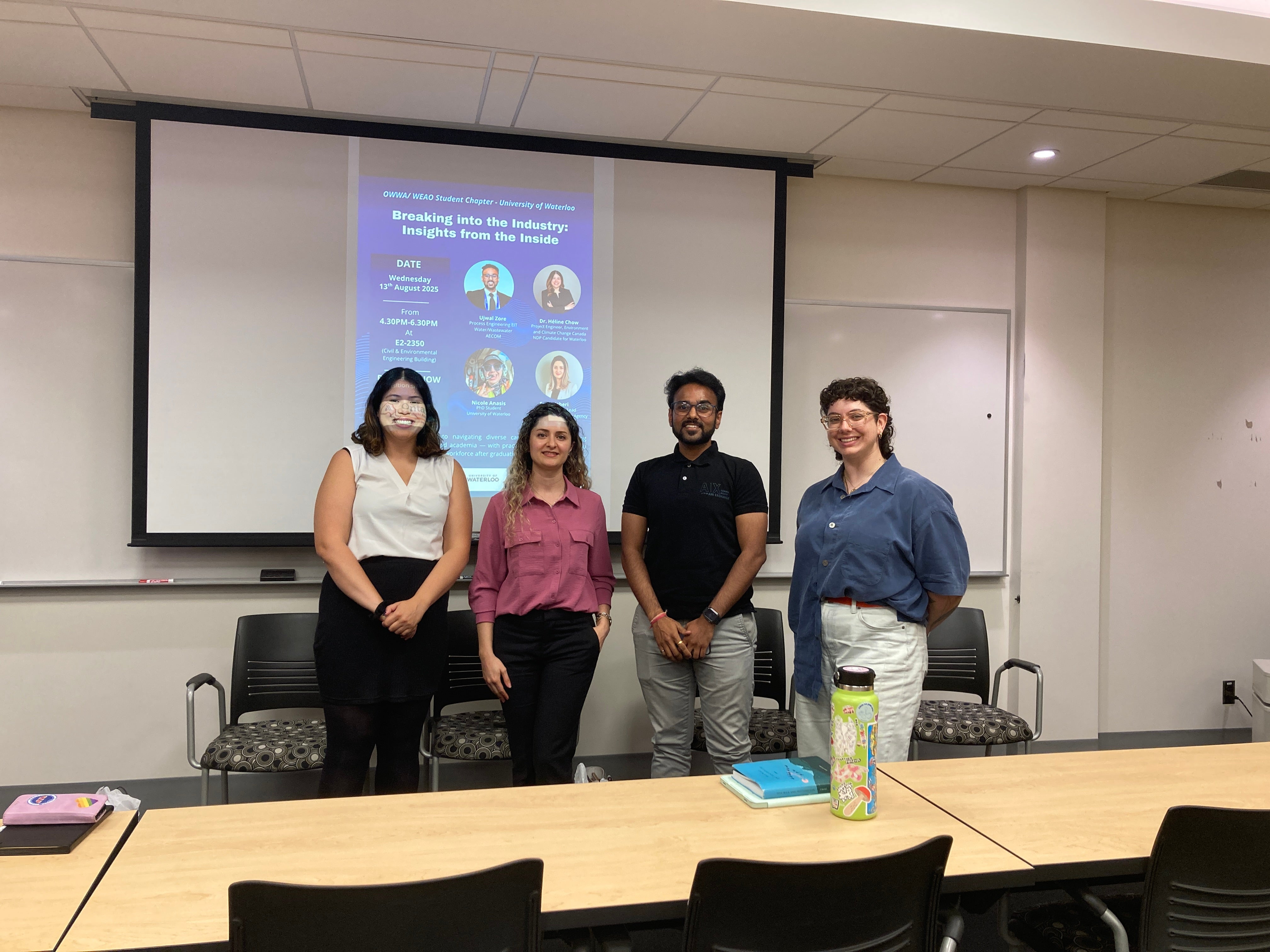 Picture of the panelists at the front of the room