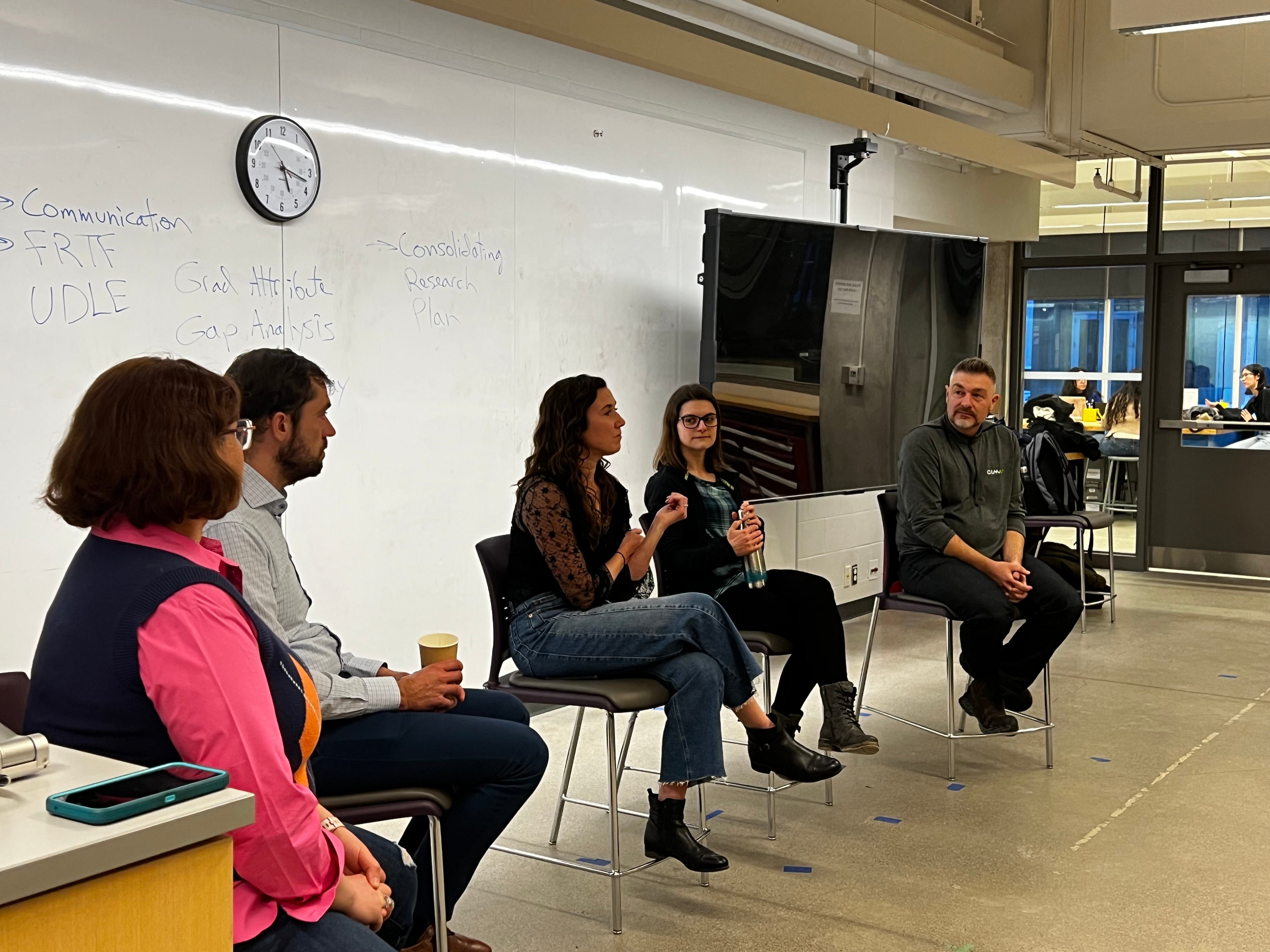 Panel that attaended sitting in the chairs answering questions