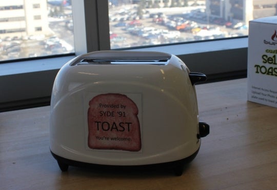 practical joke item: custom selfie toaster on a table with sticker 