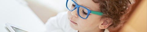 Child wearing blue spectacles