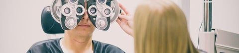 optometrist examining patient