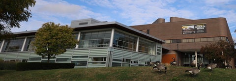 Exterior of the optometry building with Canada geese