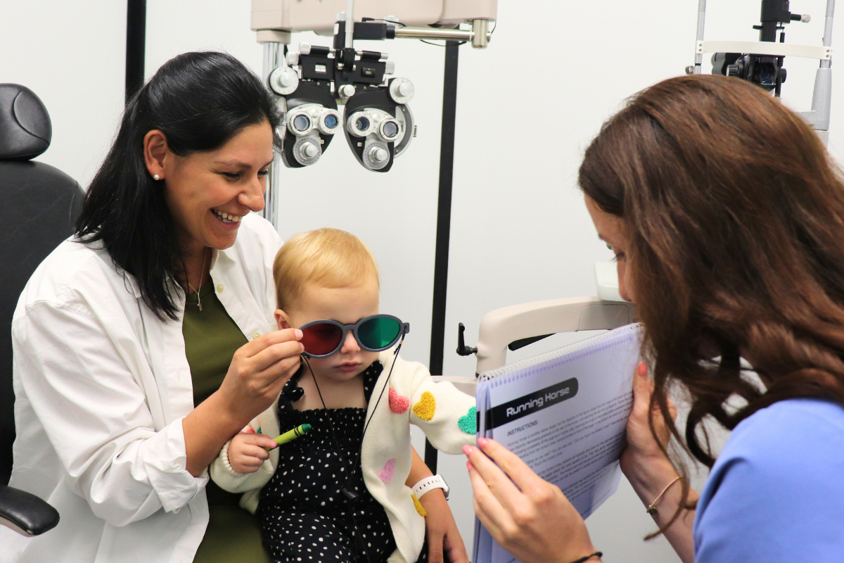 Child wearing red-green glasses