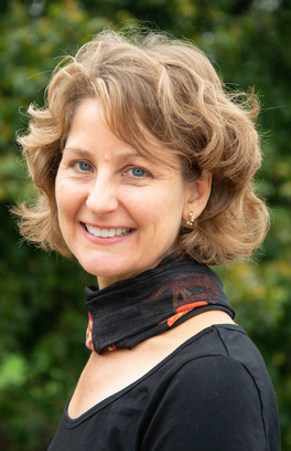 Dr. Alicia Batten smiling in a headshot