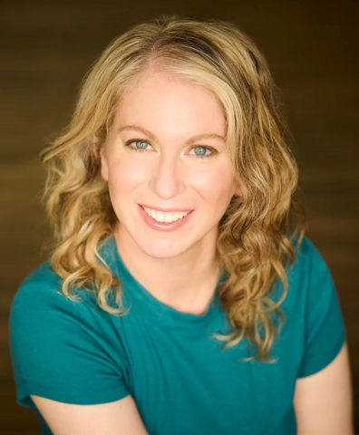 Dr. Jacqueline Feke smiling in a headshot