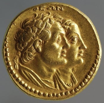 Old ancient gold going with two faces (theon) on its front