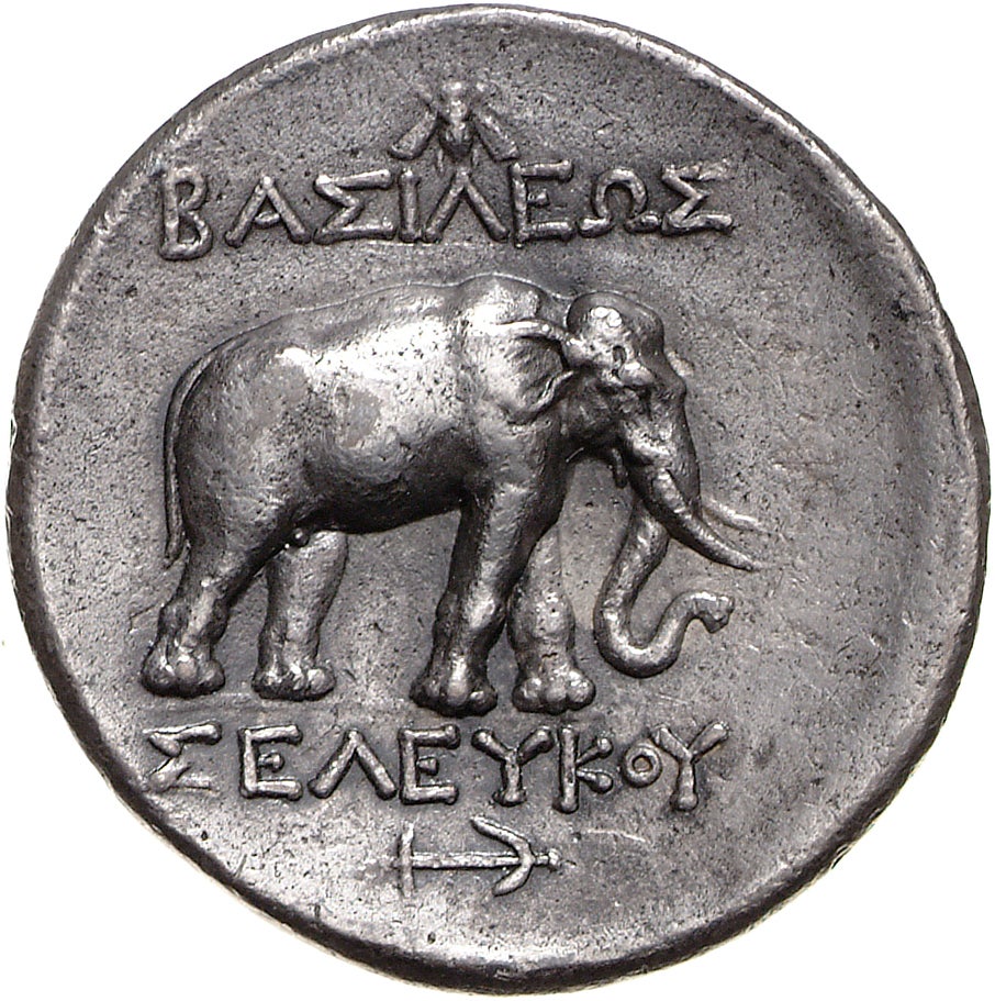 Old ancient coin with an elephant and bee on it's face