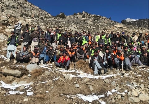 Locals working together during a glacier grafting activity 