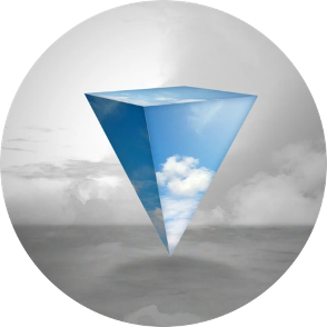 Upside down prism showing blue sky and white clouds set before a background of grey cloudy sky and sea