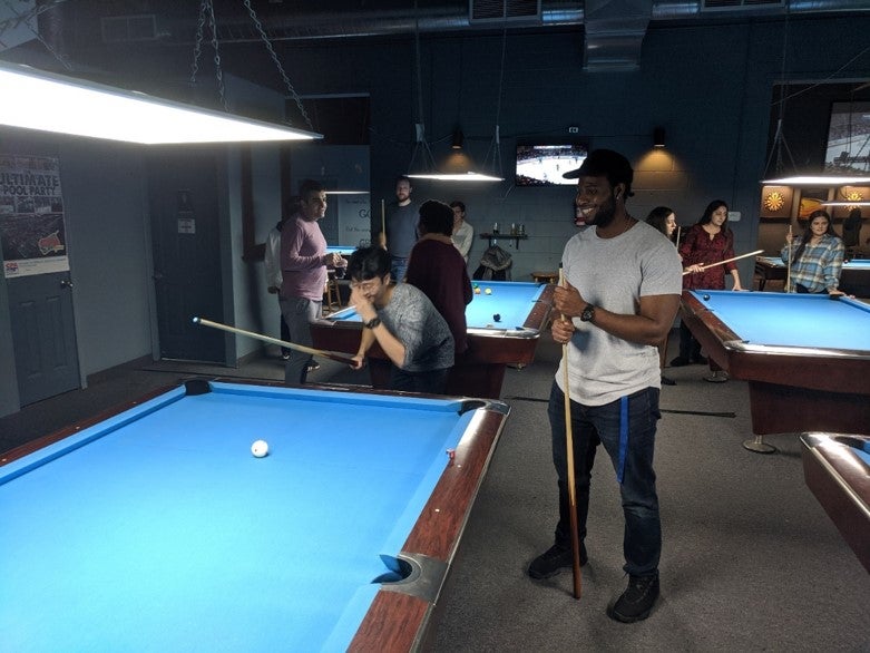 Members are playing pool