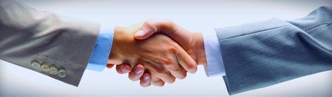 Business professionals shaking hands.