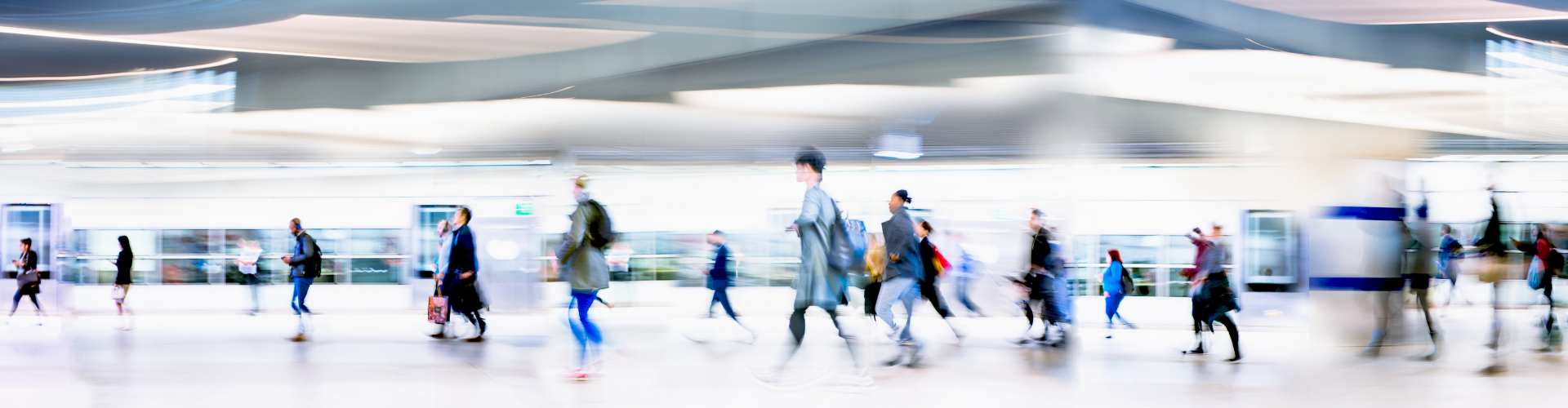 People walking at fast speed through a terminal