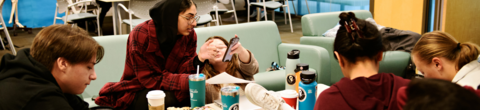 students talking on a couch