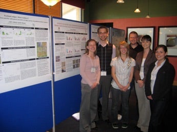 Dr. Strack and several students at a poster session.