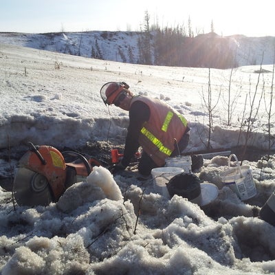 Researcher Scott installing runoff collectors