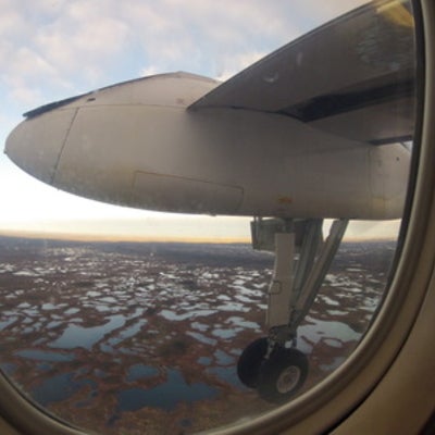  Dash-8 airplane window view of James Bay peatlands