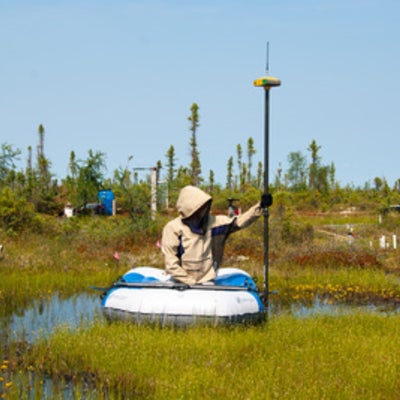 A researcher on a float with a DGPS device