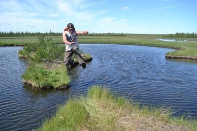  Researcher Corey jumping across a pond