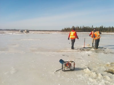  Power auger drill and researchers at Saline Fen ponds