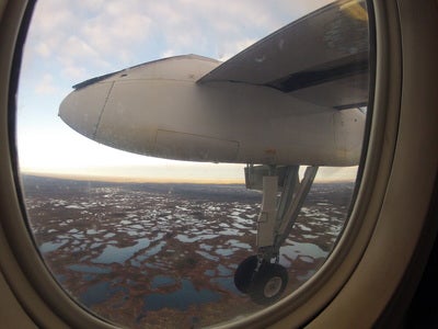  Dash-8 airplane window view of James Bay peatlands