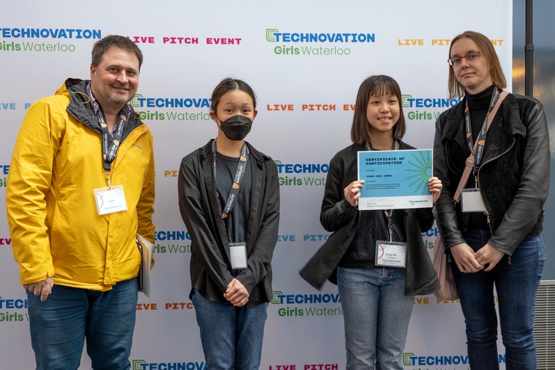 A photo of a techonovation team and their mentor