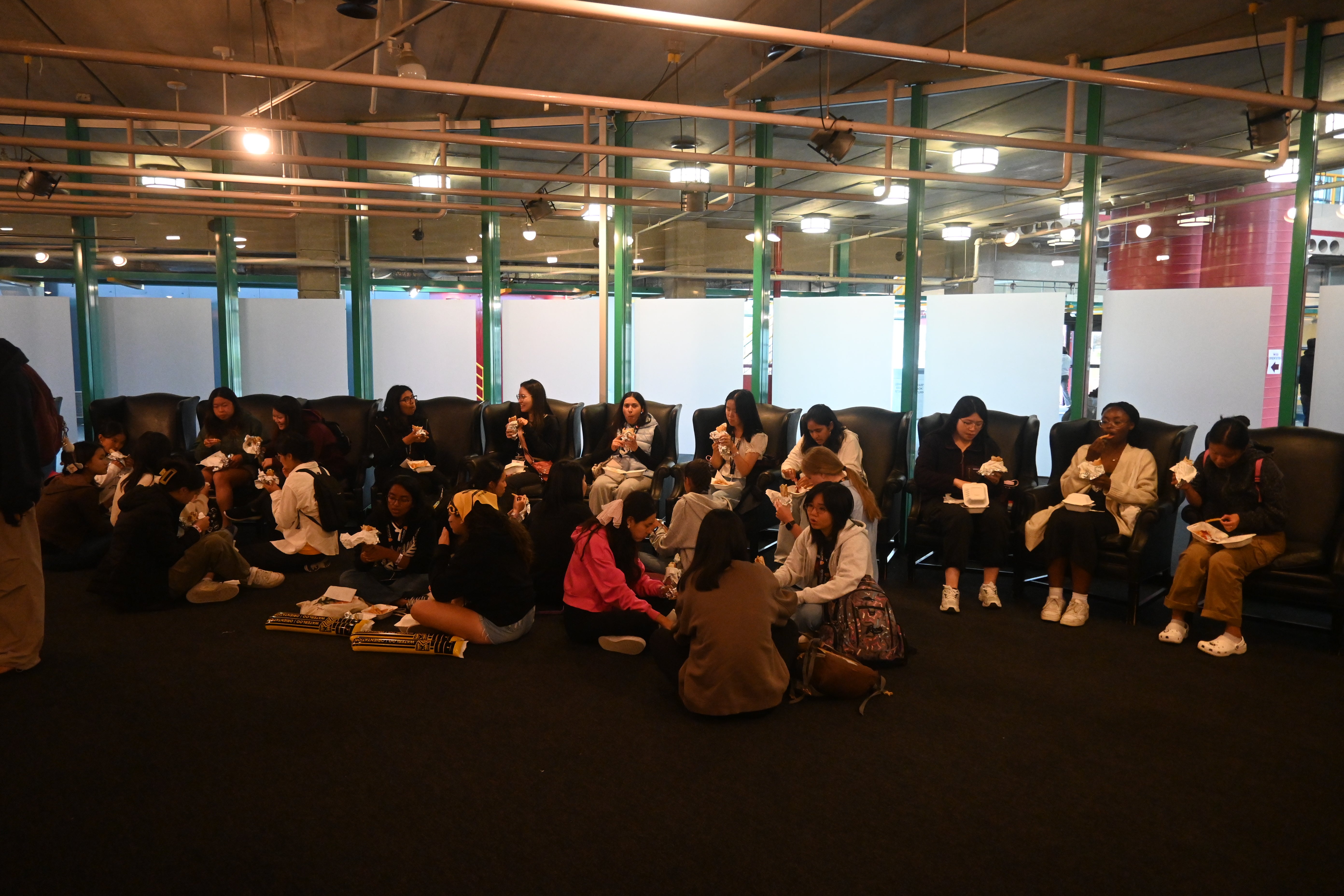 Students sitting together and having food.