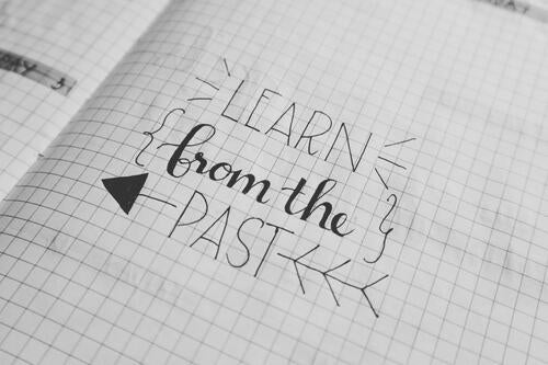 Learn from the past, written in a notebook
