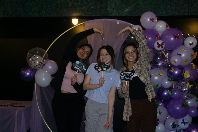 WoW participants posing at a photobooth