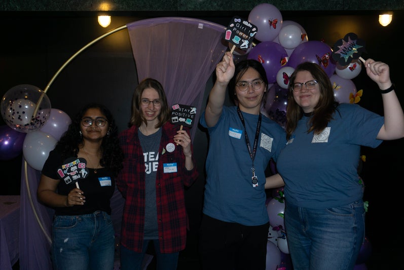 WoW participants posing at a photobooth