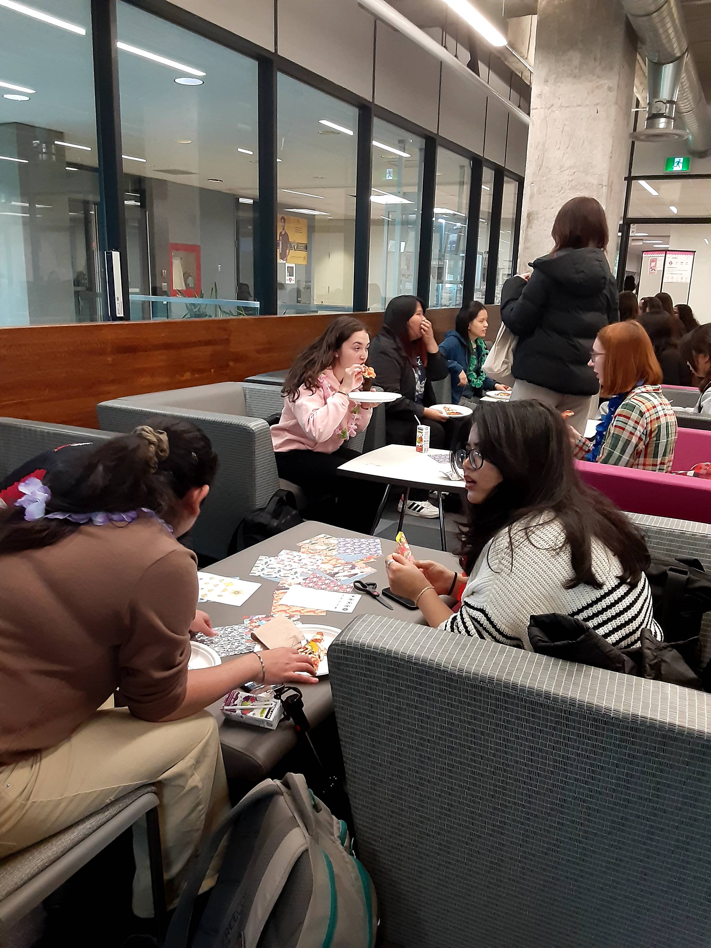 Participants eating at the Pizza Piazza