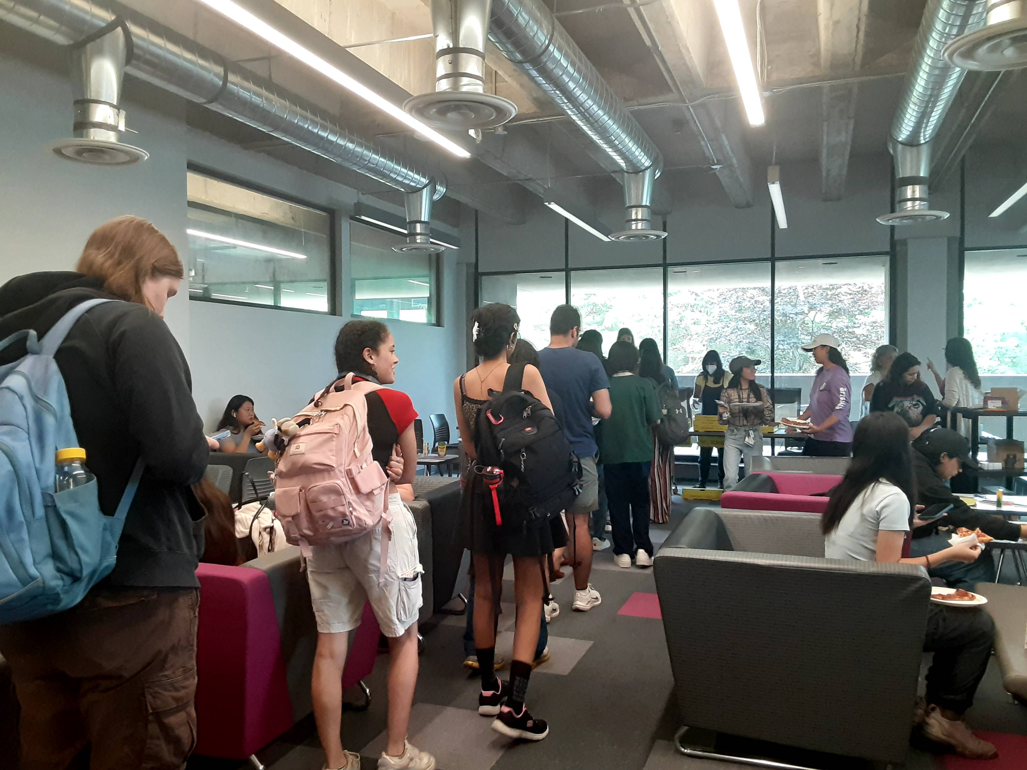 participants getting pizza