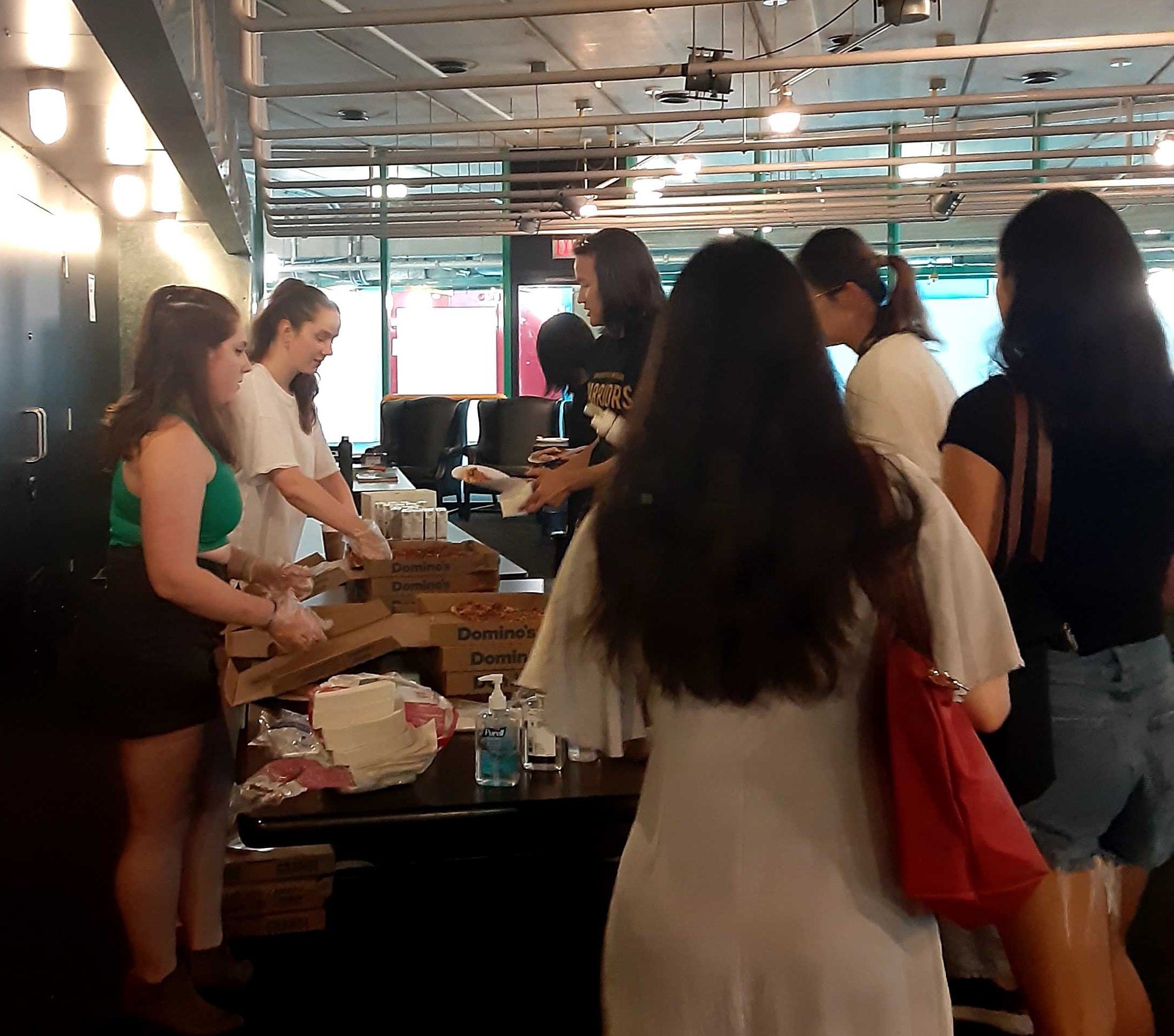 participants getting pizza