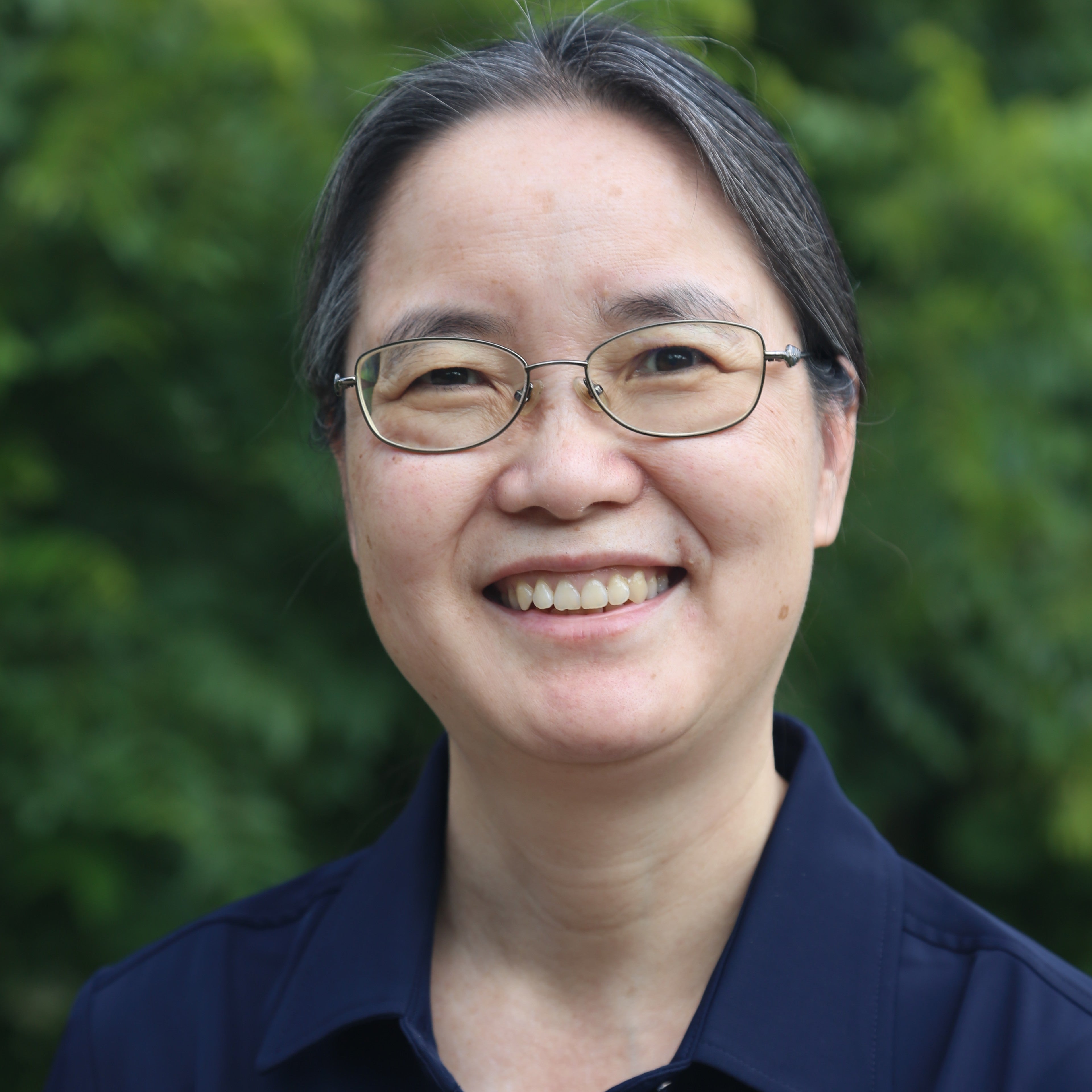 Grace Yi smiling at camera