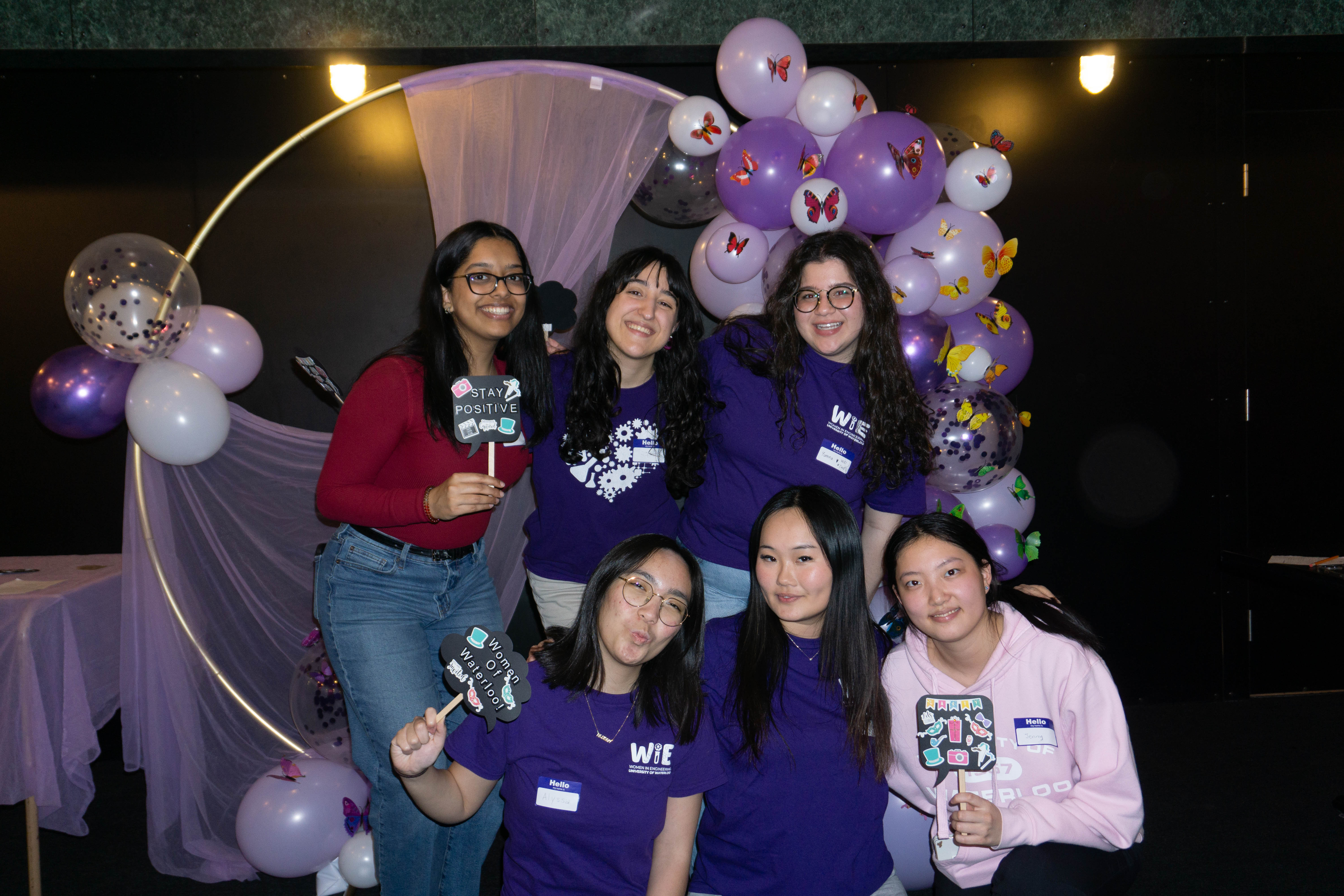 WoW participants posing at a photobooth