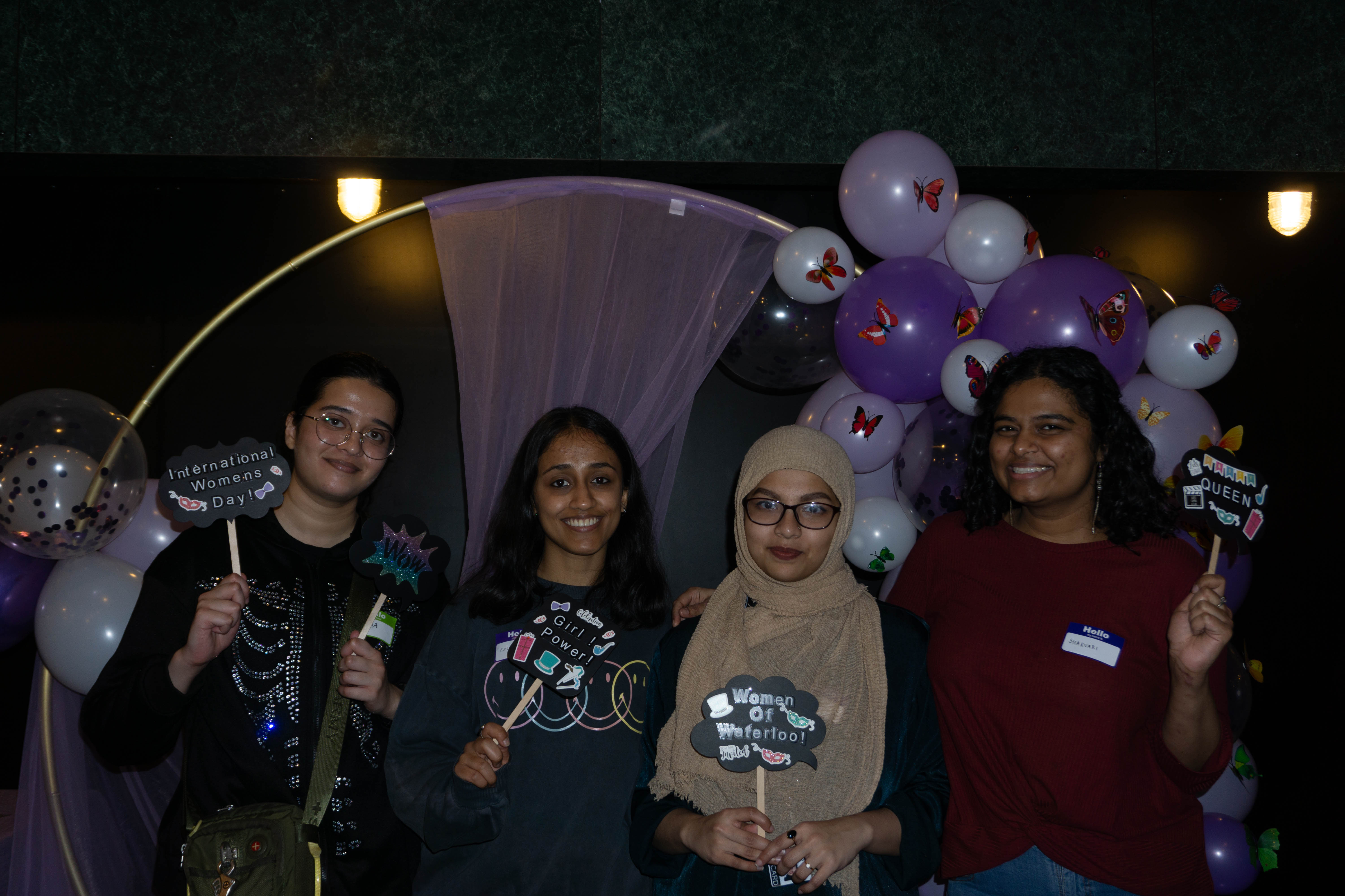 WoW participants posing at a photobooth