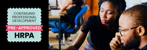 Two people working on a computer