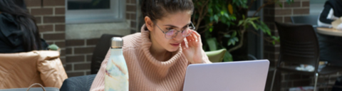 a student is studying with computer web page banner