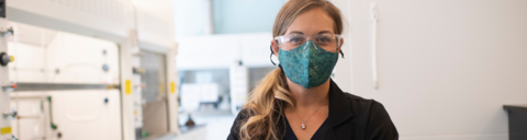 Woman wearing a mask web page banner