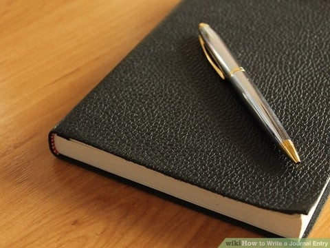 pen on a black notebook