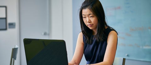 student working on a laptop