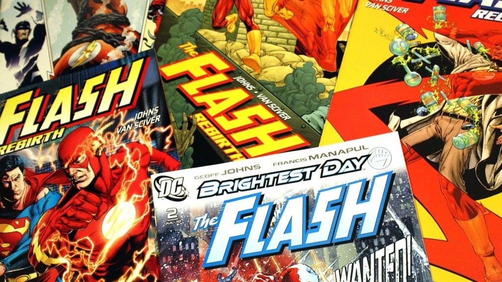 A stack of "The Flash" comic books
