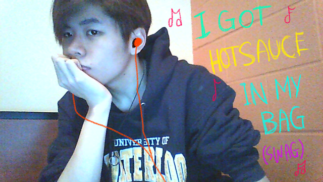 Me wearing earphones, listening to Beyonce's single 