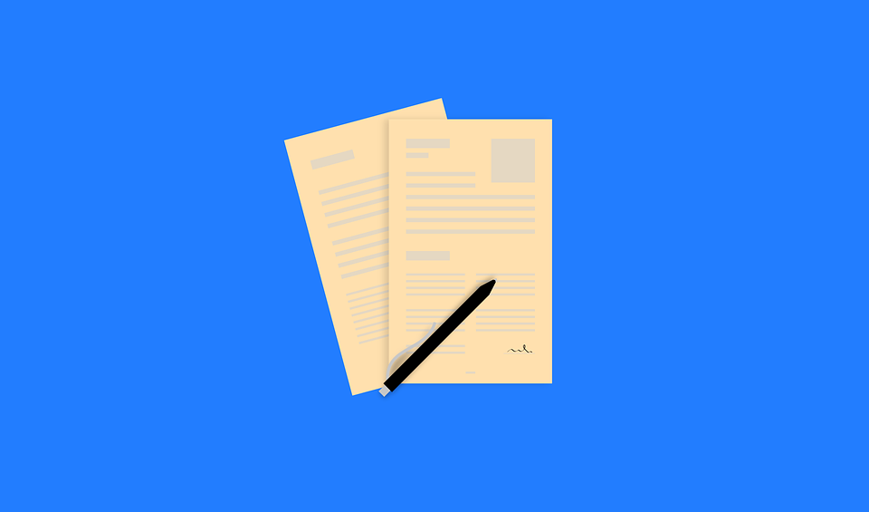 Photo (from Pixabay) of application papers against a blue backdrop