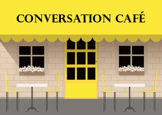 A café with Conversation Café on the awning