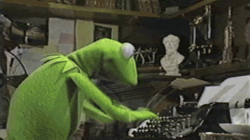 Gif of Kermit the frog typing very quickly on a typewriter.