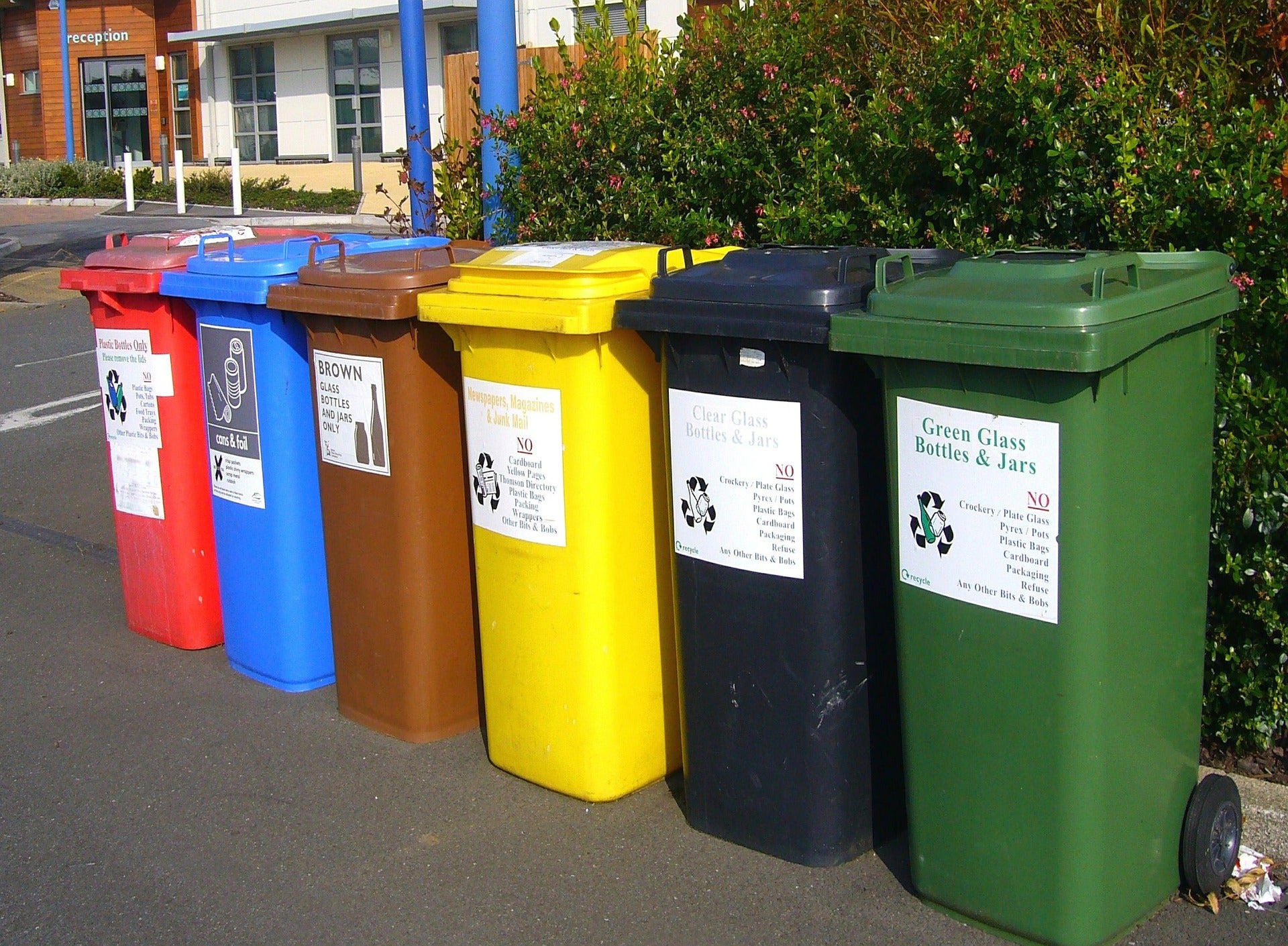 compost garbage and recycling bins outside