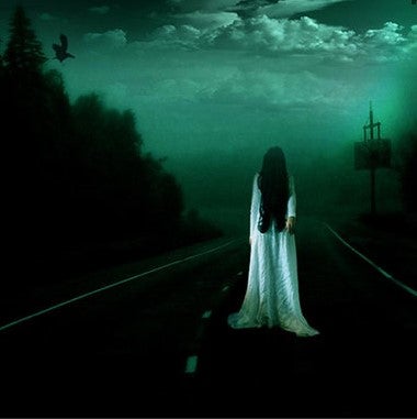 Unknown ghost girl standing in the middle of the road.