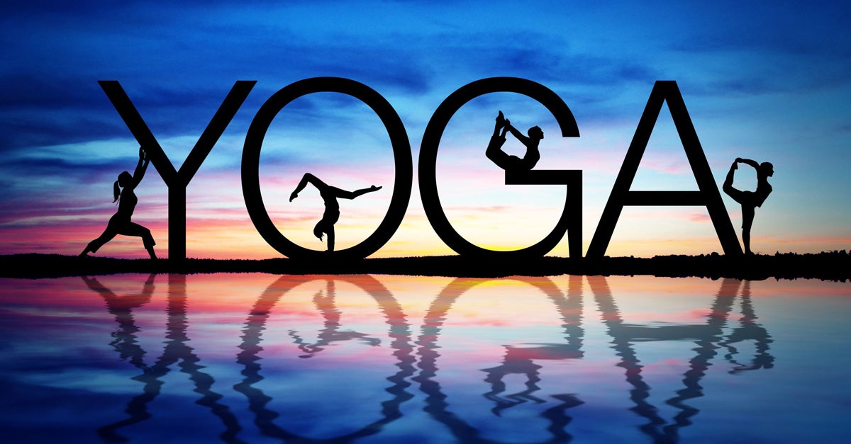 An image of YOGA with people doing yoga posses within the letters