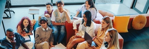 Group of students in a casual setting having a lively discussion 